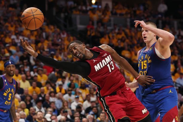 Bam Adebayo of the Miami Heat battles Nikola Jokic of the Denver Nuggets during the fourth quarter in Game One of the 2023 NBA Finals at Ball Arena...