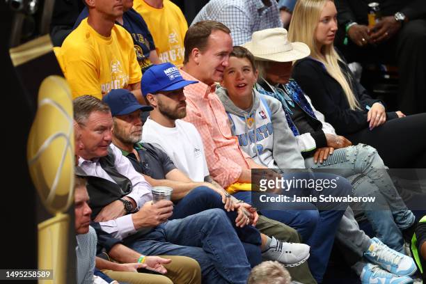 Peyton Manning and son Marshall are seen in attendance during Game One of the 2023 NBA Finals between the Denver Nuggets and the Miami Heat at Ball...