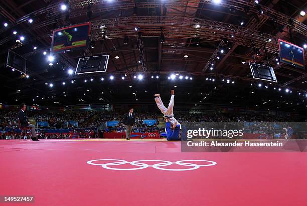 Dirk Van Tichelt of Belgium competes with Nicholas Delpopolo of the United States in the Men's -73 kg Judo on Day 3 of the London 2012 Olympic Games...