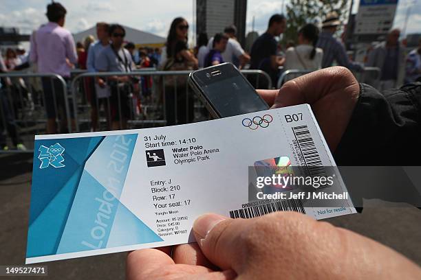 Member of the public holds a ticket for the water polo during Day 3 of the London 2012 Olympic games at the Olympic Park on July 30, 2012 in London,...