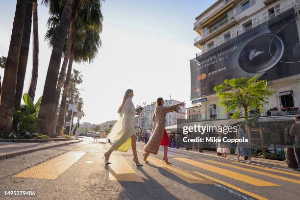 View of people on the Croisette crossing the street during the 76th annual Cannes film festival at on May 21, 2023 in Cannes, France.