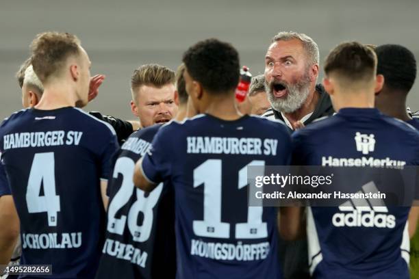 Tim Walter, Head Coach of Hamburger SV, speaks to his players after the team's defeat in the Bundesliga playoffs first leg match between VfB...