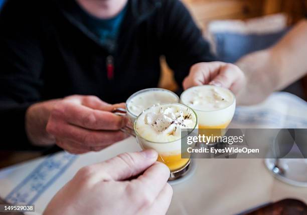 Bombardino, a hot egg liqueur, advocaat, with whipped cream - a typical aprÃs-ski hard liquor booze drink at the bar of the alpine mountain hut...