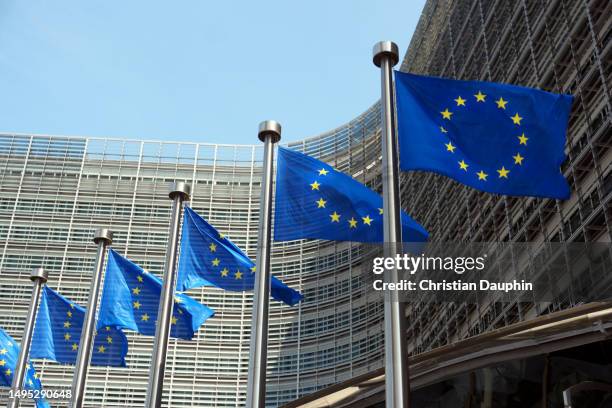 european commission, european flags at berlaymont building. - european capital of culture stock pictures, royalty-free photos & images