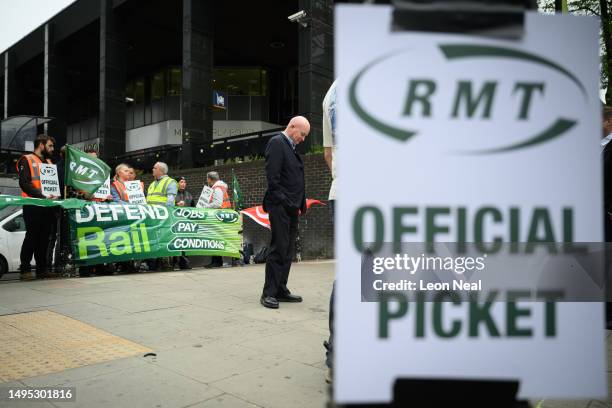 Secretary-General of the National Union of Rail, Maritime and Transport Workers Mick Lynch waits for the start of a live interview with a news...