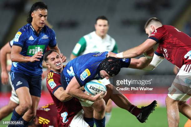 James Tucker of the Blues is tackled during the round 15 Super Rugby Pacific match between Blues and Highlanders at Eden Park, on June 02 in...