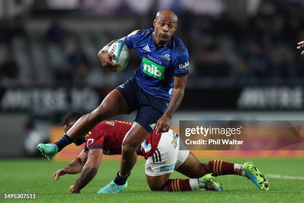 Mark Telea of the Blues is tackled during the round 15 Super Rugby Pacific match between Blues and Hurricanes at Eden Park, on June 02 in Auckland,...