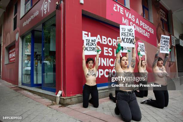 Activists rally with posters at the door of Pro Vida shelter, on 02 June, 2023 in Madrid, Spain. Femen Spain has called today a demonstration to...