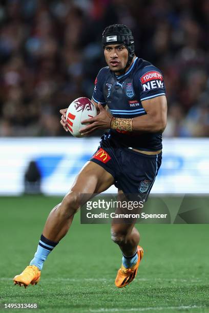 Stephen Crichton of the Blues runs the ball during game one of the 2023 State of Origin series between the Queensland Maroons and New South Wales...
