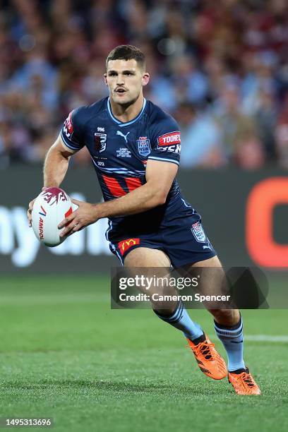 Nathan Cleary of the Blues runs the ball during game one of the 2023 State of Origin series between the Queensland Maroons and New South Wales Blues...