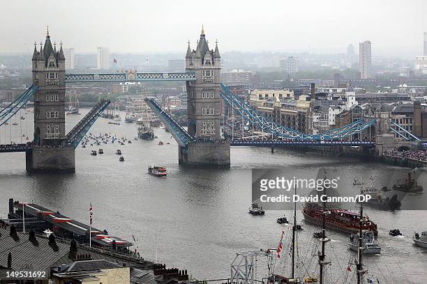 The royal barge 'The Spirit of Chartwell' approaches Tower Bridge, as seen from The Monument, as it is raised in salute of Queen Elizabeth II during...