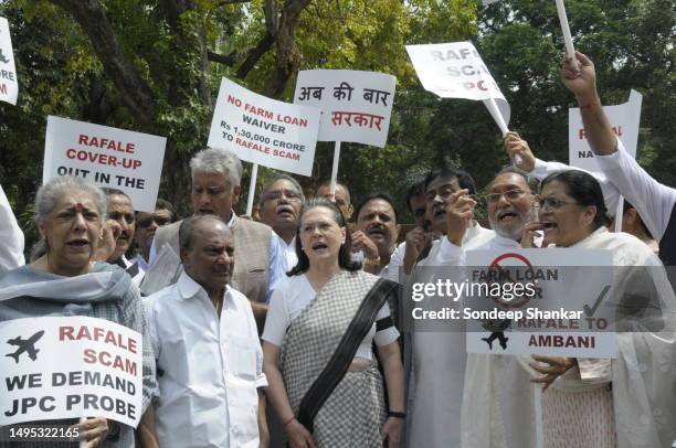 Congress President Sonia Gandhi joins party Members of Parliament protest against the purchase of Rafael fighter jets alleging huge kick-backs to the...