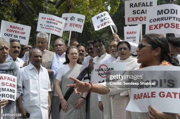 Congress President Sonia Gandhi joins party Members of Parliament protest against the purchase of Rafael fighter jets alleging huge kick-backs to the...
