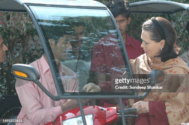 Unied Progressive Alliance chairperson Sonia Gandhi distributing motorised vehicles to disabled person from different parts of India at her residence...