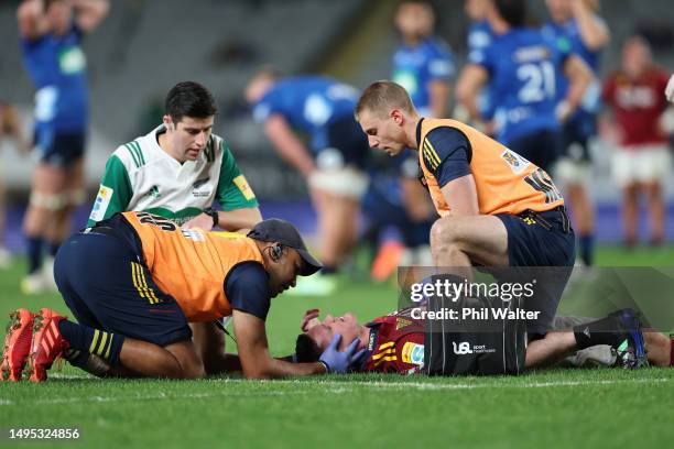 Freddie Burns of the Highlanders leaves the field injured during the round 15 Super Rugby Pacific match between Blues and Highlanders at Eden Park,...