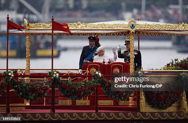 Queen Elizabeth II, Prince Philip, Duke of Edinburgh, Catherine, Duchess of Cambridge and Prince William, Duke of Cambridge sail on the royal barge...