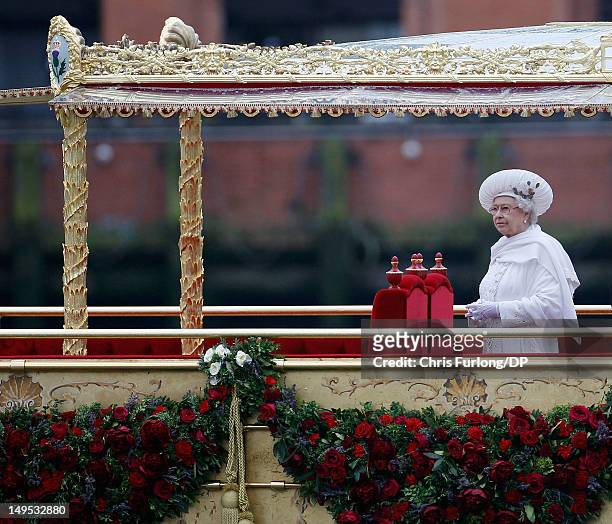 Queen Elizabeth sails on the royal barge 'The Spirit of Chartwell' during the Thames Diamond Jubilee River Pageant during the Thames Diamond Jubilee...