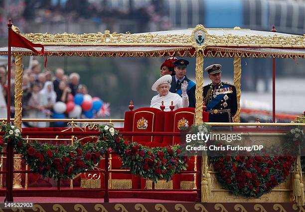 Queen Elizabeth II, Prince Philip, Duke of Edinburgh, Catherine, Duchess of Cambridge and Prince William, Duke of Cambridge sail on the royal barge...