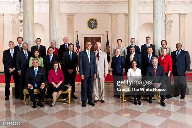 In this handout provided by the White House, U.S. President Barack Obama and Vice President Joe Biden pose with the full Cabinet for an official...