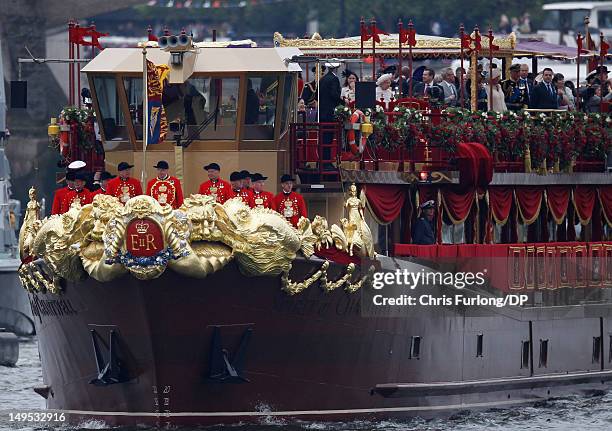 Queen Elizabeth II and other members of the Royal family sail on the royal barge 'The Spirit of Chartwell' during the Thames Diamond Jubilee River...