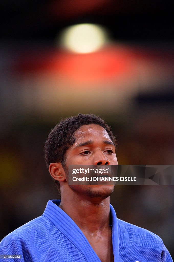 Netherlands' Dex Elmont looks on after l