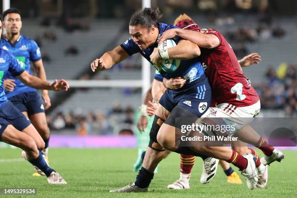 Caleb Clarke of the Blues is tackled during the round 15 Super Rugby Pacific match between Blues and Highlanders at Eden Park, on June 02 in...