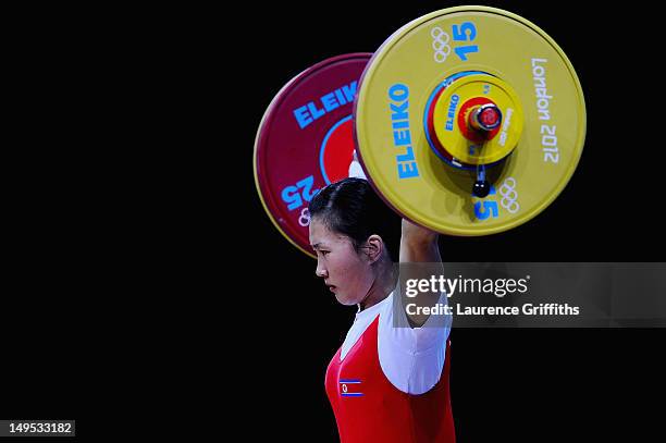 Chun Mi Jong of DPR Korea competes in the Women's 58kg Weightlifting on Day 3 of the London 2012 Olympic Games at ExCeL on July 30, 2012 in London,...