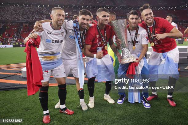 Argentinian players Alejandro Papu Gomez , Gonzalo Montiel , Erik Lamela , Marcos Acuna and Lucas Ocampos of Sevilla FC pose with the trophy after...