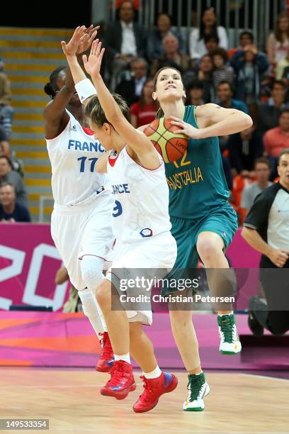 Belinda Snell of Australia shoots from halfway down the court to score three points and tie the Women's Basketball Preliminary Round match on Day 3...