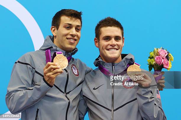Nicholas Mccrory and David Boudiaof the United States celebrate with their bronze medals during the medal ceremony for the Men's Synchronised 10m...