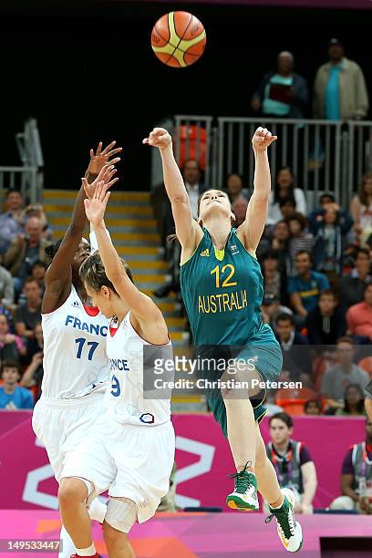 Belinda Snell of Australia hits a game tying three point shot as time runs out over Celine Dumerc of France to force extra time during the Women's...