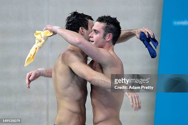 Nicholas McCrory and David Boudia of the United States look on from the pool deck as they compete in the Men's Synchronised 10m Platform Diving on...