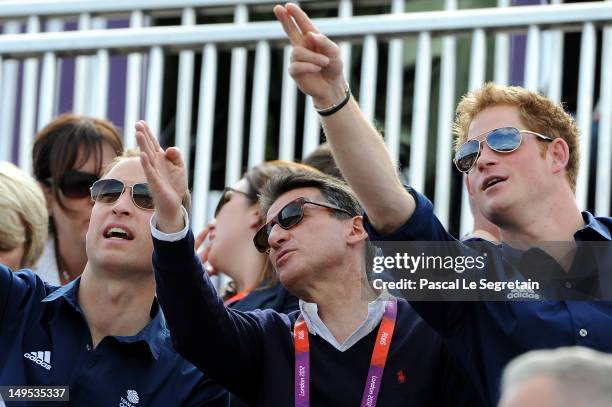 Prince William, Duke of Cambridge, LOCOG Chair Lord Sebastian Coe, and Prince Harry watch the Eventing Cross Country Equestrian event on Day 3 of the...