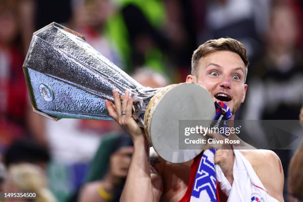 Ivan Rakitic of Sevilla FC holds the winners trophy after the UEFA Europa League 2022/23 final match between Sevilla FC and AS Roma at Puskas Arena...