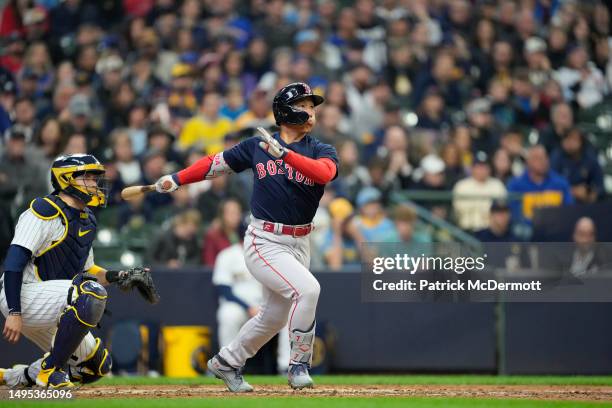 Masataka Yoshida of the Boston Red Sox hits a solo home run in the eighth inning against the Milwaukee Brewers at American Family Field on April 23,...