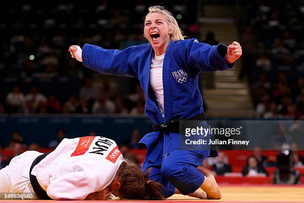 Automne Pavia of France celebrates her bronze medal B over Hedvig Karakas of Hungary during the Women's -57 kg Judo on Day 3 of the London 2012...
