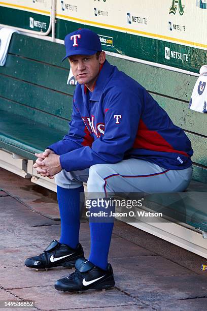 Roy Oswalt of the Texas Rangers sits in the dugout before the game against the Oakland Athletics at O.co Coliseum on July 17, 2012 in Oakland,...