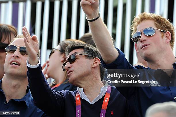 Prince William, Duke of Cambridge, LOCOG Chair Lord Sebastian Coe, and Prince Harry watch the Eventing Cross Country Equestrian event on Day 3 of the...