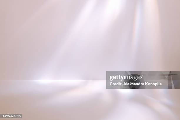 dreamy pink beige, pastel nude colored display background with disco crystal caustic light effect. empty 3d stage template. trendy natural colors - stage light 3d stock pictures, royalty-free photos & images
