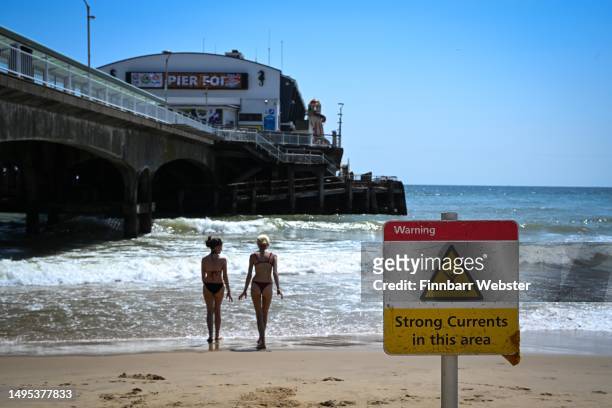 Sign warning of strong currents is seen at Bournemouth Pier, following the deaths of two children at Bournemouth beach on 31st May, on June 02, 2023...