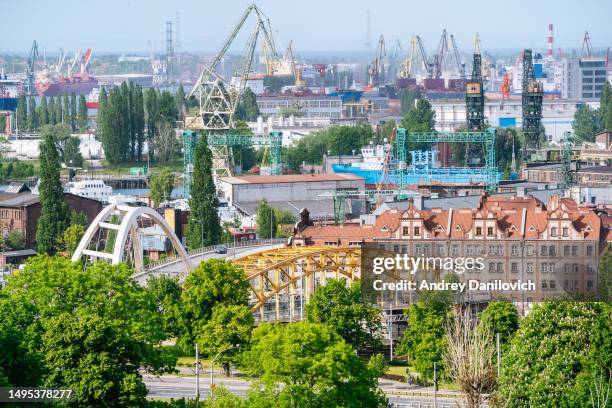 gdansk industrial area: panoramic view from gradowa hill with stocznia gdańska shipping yard, cranes, and bridges. - pomorskie province stock pictures, royalty-free photos & images
