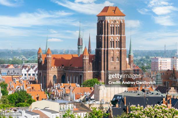 gdansk old town from gradowa hill: st. mary's basilica and blue sky with clouds. - pomorskie province stock pictures, royalty-free photos & images
