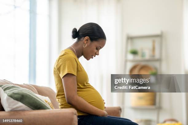 waiting for baby - muscular contraction stock pictures, royalty-free photos & images