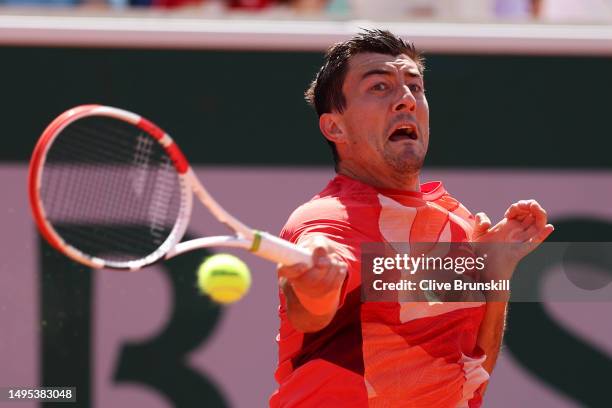 Sebastian Ofner of Austria plays a forehand against Fabio Fognini of Italy during the Men's Singles Third Round match on Day Six of the 2023 French...