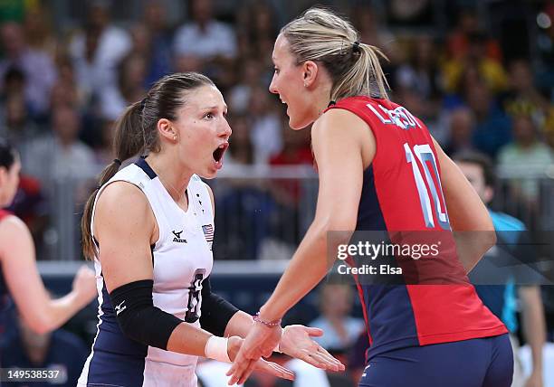 Nicole Davis of United States celebrates a point with team mate Jordan Larson in the Women's Volleyball Preliminary match between the United States...