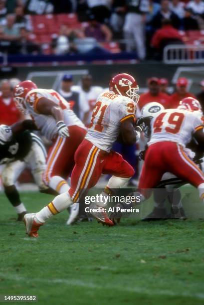 Running Back Priest Holmes of the Kansas City Chiefs has a long gain in the game between the Kansas City Chiefs vs the New York Jets at The...
