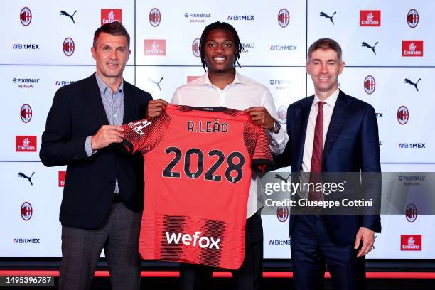 Milan Director Paolo Maldini, Rafael Leao and AC Milan Director of Football Frederic Massara pose with a jersey that reads 2028 as Leao extends his...