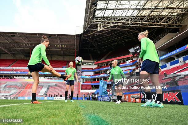 Dominique Janssen, Merle Frohms, Lena Lattwein and Alexandra Popp of VfL Wolfsburg train during a training session prior to the UEFA Women's...