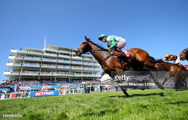 Cadillac ridden by Kevin Slott wins the Betfred Handicap Stakes during Ladies Day of the Derby Festival at Epsom Downs Racecourse on June 02, 2023 in...
