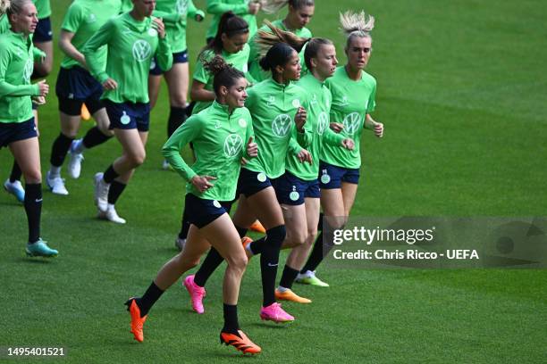 Dominique Janssen, Sveindis Jane Jonsdottir, Lynn Wilms and Jill Roord of VfL Wolfsburg run during a training session prior to the UEFA Women's...